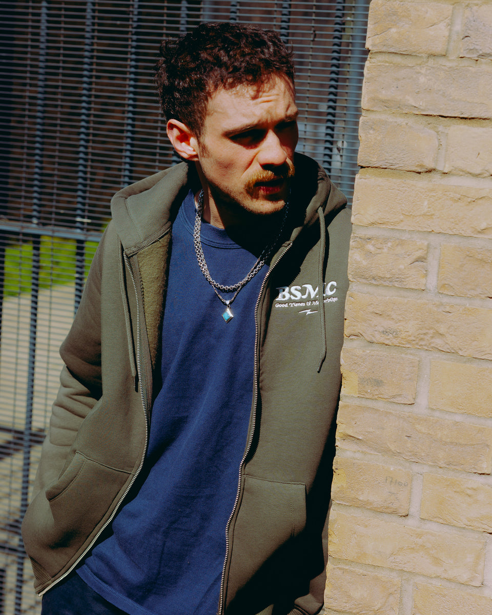 Green hoodie with 'Bike Shed Motorcycle Co.' embroidered on the front