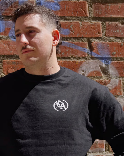 BSMC LA Rocker Long Sleeve T-Shirt - Black worn by model in front of a brick wall logo detail