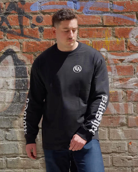 BSMC LA Rocker Long Sleeve T-Shirt - Black worn by model in front of a brick wall