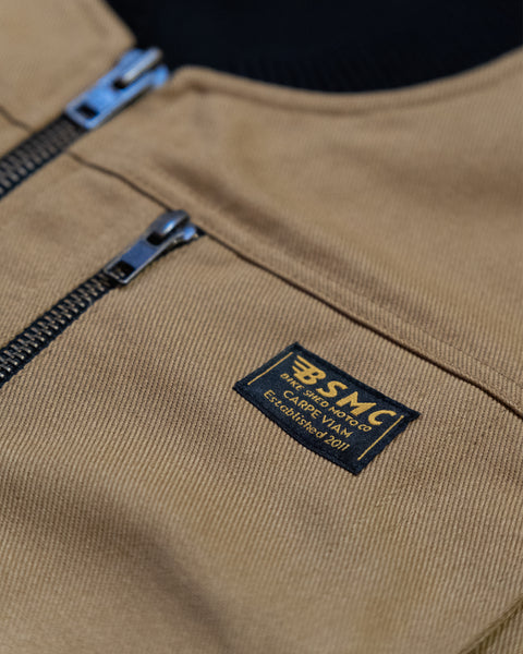 BSMC Utility Vest - Tan studio image chest logo close up