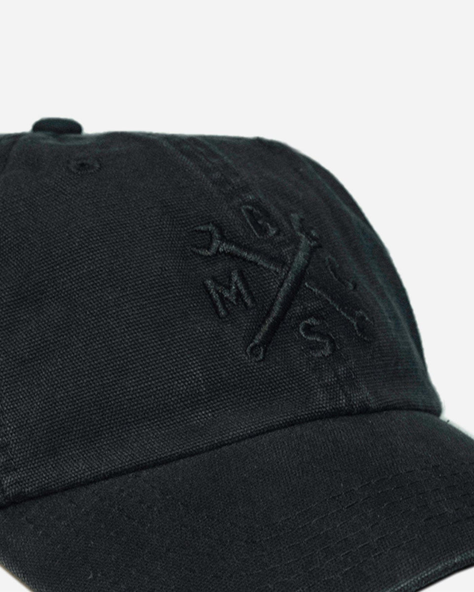 A black, unstructured baseball cap with an embroidered Bike Shed Moto Co. logo on the front detail