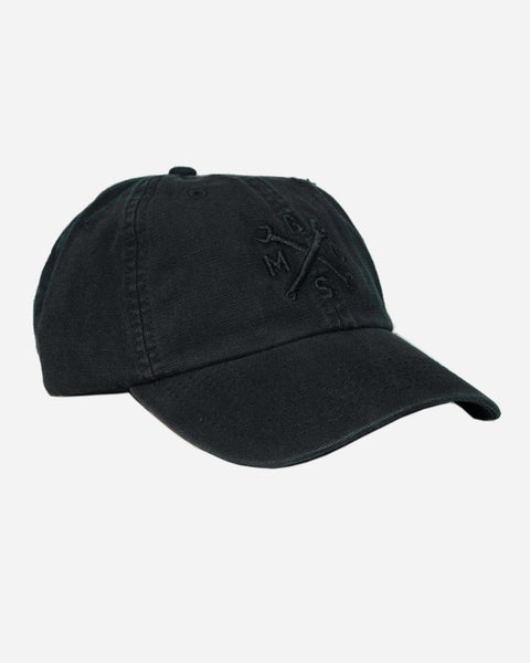 A black, unstructured baseball cap with an embroidered Bike Shed Moto Co. logo on the front.