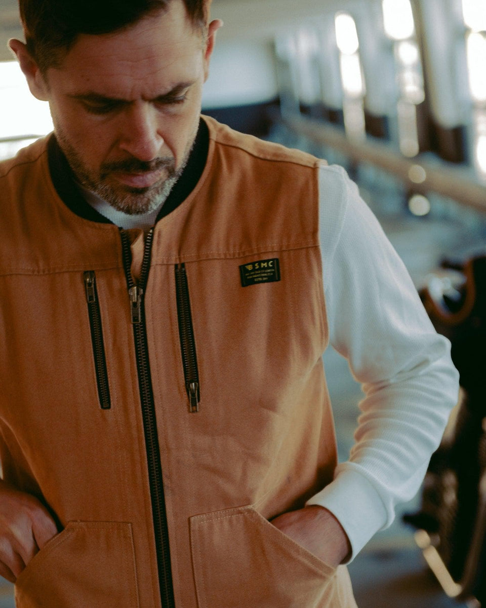 Sam wearing our Motorcycle utility vest with multiple pockets and zipper detailing - Tan