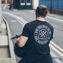 Steve sitting on a Royal Enfield wearing our BSMC 1580 Roundel T Shirt - Black