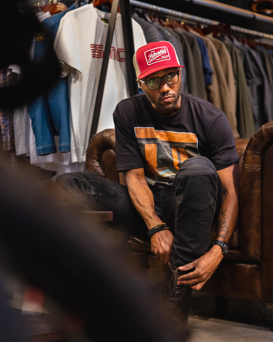 Model, suiting up while wearing our BSMC Inc. Cap - Burgundy & Cream