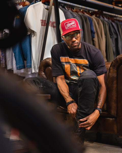 Model, suiting up while wearing our BSMC Inc. Cap - Burgundy & Cream