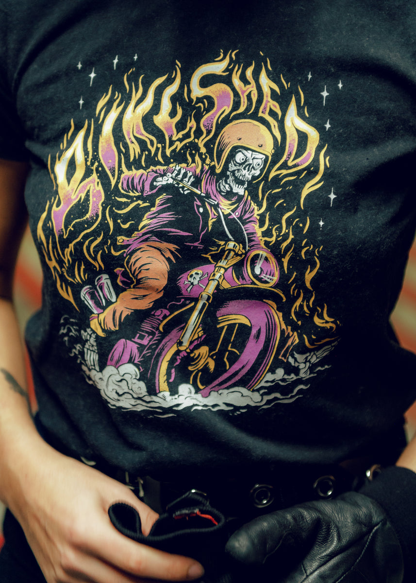 Model wearing our BSMC Women's Speed Demon Graphic T-Shirt - Washed Black, logo close up