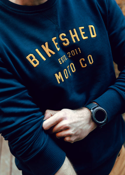 Alen wearing our BSMC Moto Co. logo Sweatshirt - Navy/Mustard, close up