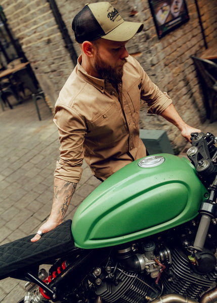 Jimbo wheeling his bike wearing our BSMC Ripstop Utility Shirt MKII - TAN