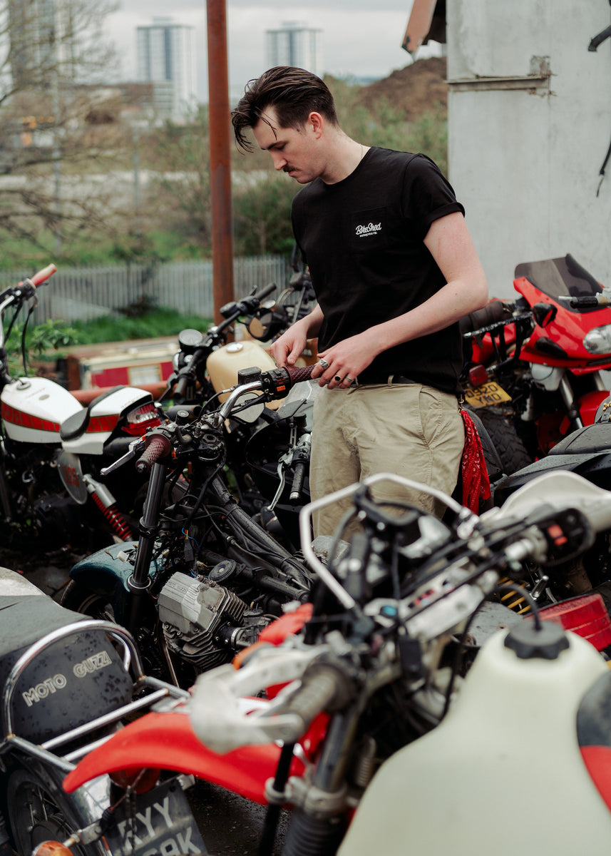 Joe inspecting bike in our BSMC Logo Chain Embroidered T Shirt - Black