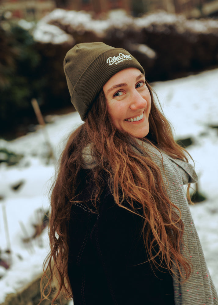 Leoma smiling and wearing our chain stitch beanie 
