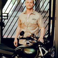 Steve with his Triumph wearing our BSMC Garage Shirt - Tan & Black