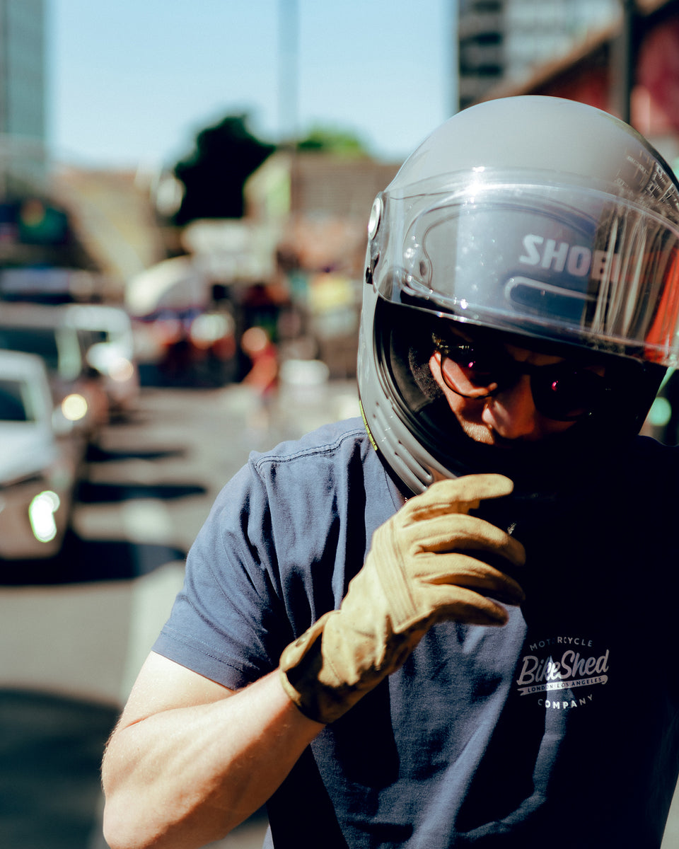 Steve adjusting his helmet while wearing our BSMC Company Logo T-Shirt - Navy
