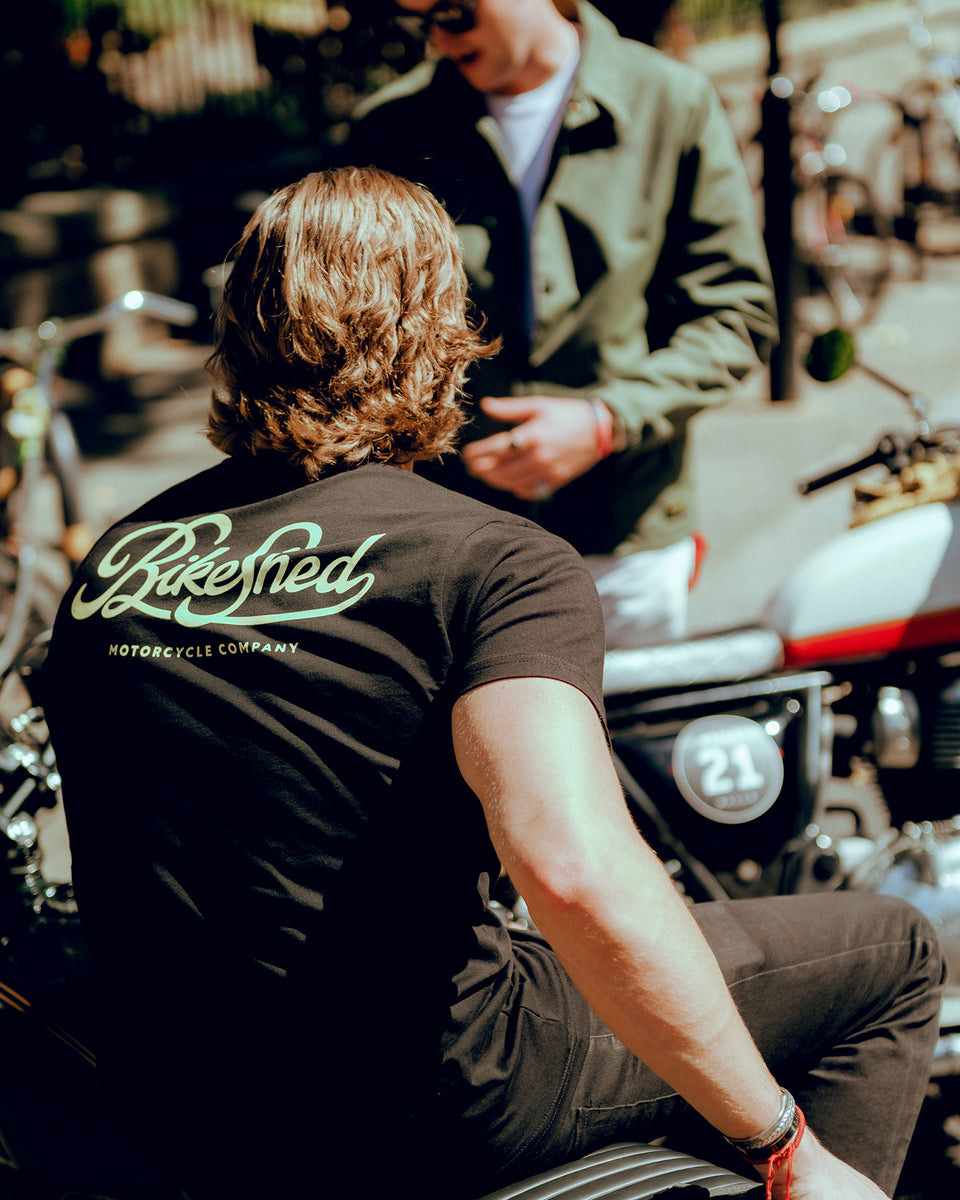 Harry chatting while wearing our BSMC Motorcycle Garage T Shirt - Black & Gold