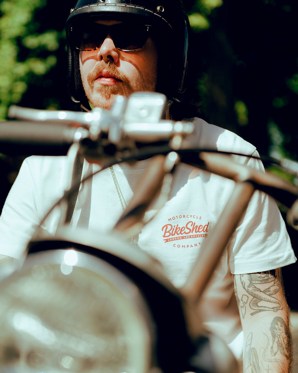 Close up of James wearing our Bike Shed Moto Co. Company T-Shirt - Off White