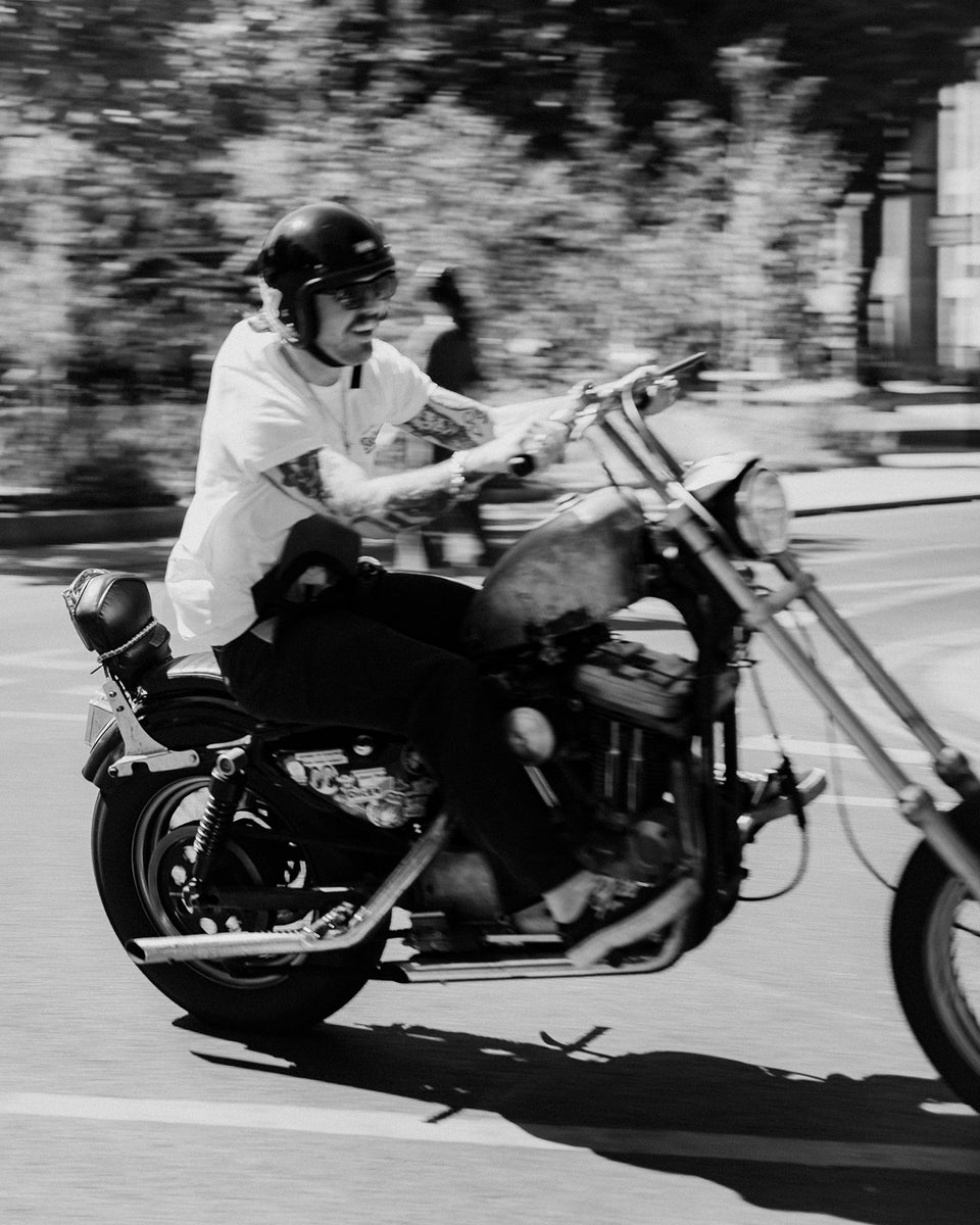 James riding his Harley wearing our Bike Shed Moto Co. Company T-Shirt - Off White