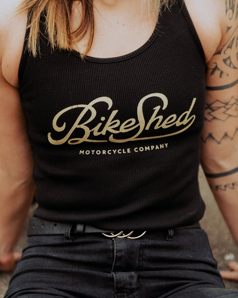 Model posing wearing our Women's Motorcycle Garage Ribbed Tank Top - Black