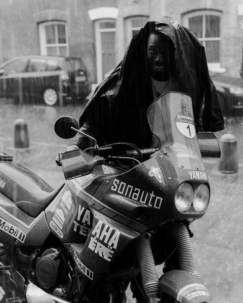 Model using our BSMC Company Coach Motorcycle Jacket - Black as an umbrella