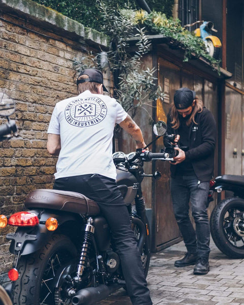Dutch sitting on a Triumph Bonnie wearing our BSMC 1580 Roundel T Shirt - White