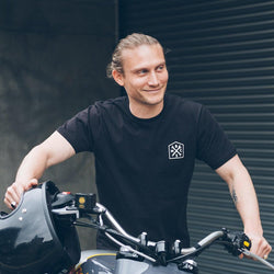 Steve wheeling a Royal Enfield while wearing our BSMC 1580 Roundel T Shirt - Black