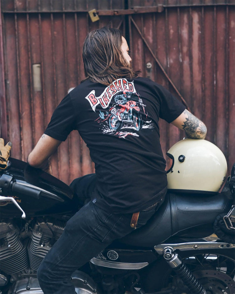 Simon sitting on his Harley wearing our BSMC Dead Dakar Doug T Shirt - Black