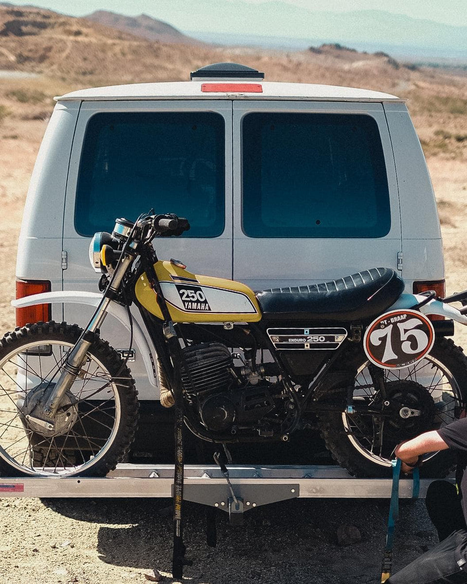 Matching colour Yamaha 250 being transported on the back of a van