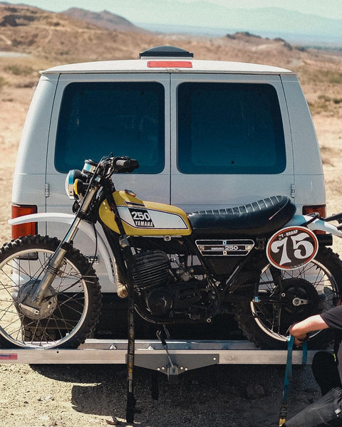 Matching colour Yamaha 250 being transported on the back of a van