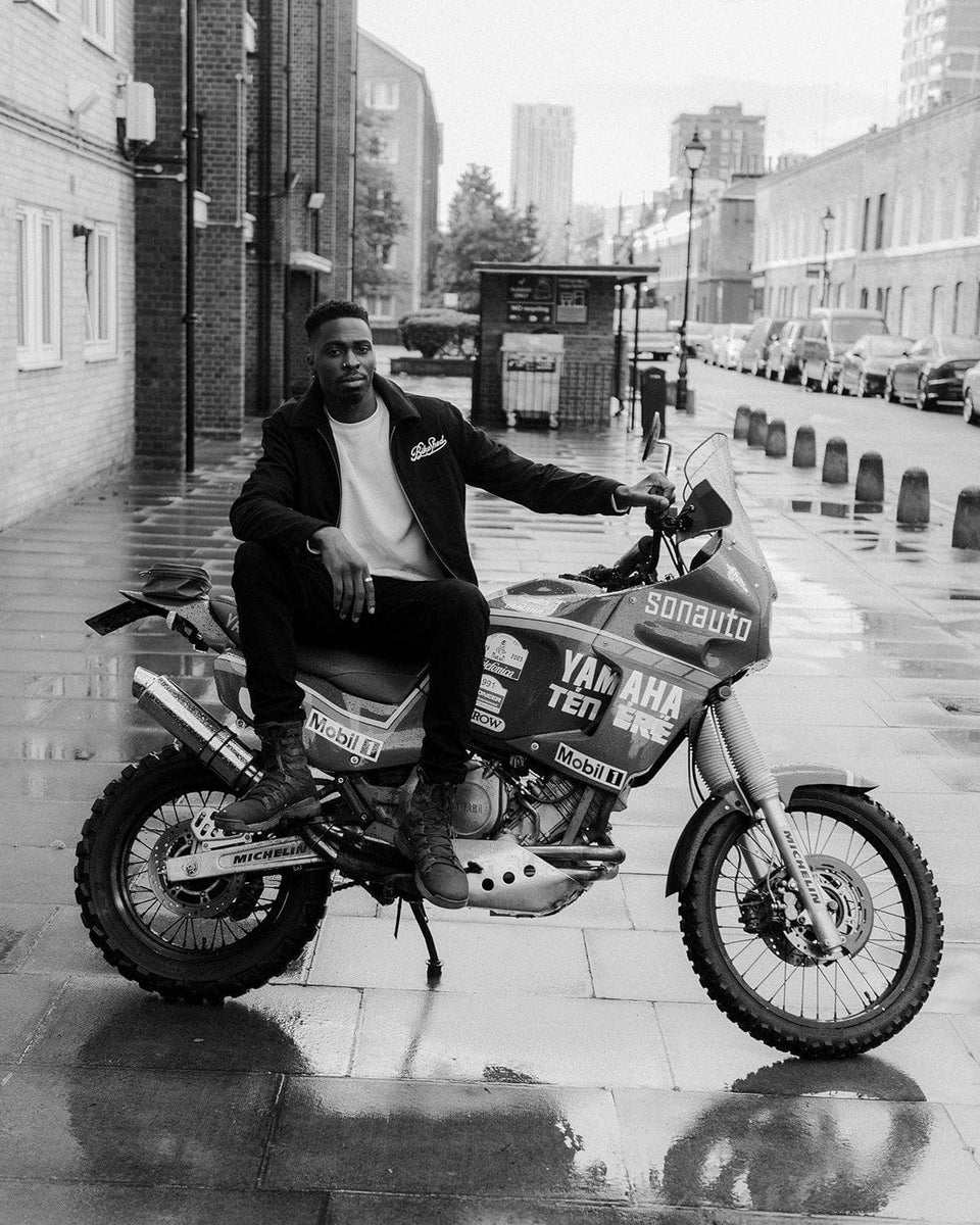 Model sitting on his Yamaha Tenere wearing our Embroidered Motorcycle Club Waffle Long Sleeve T-Shirt - Ecru