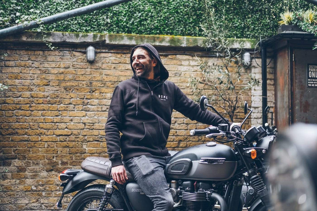 Dan sitting on his Triumph wearing our BSMC ESTD. Hoodie - Black