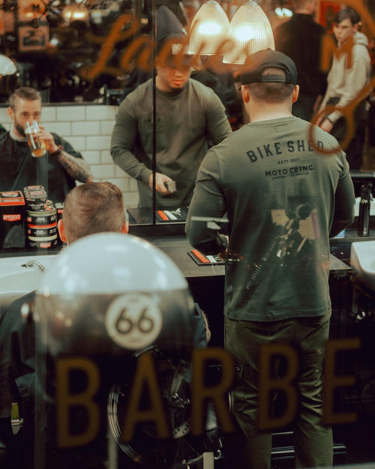 Isaac wearing our BSMC Estd. LS220P - Khaki in our barbershop