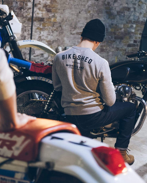 Harry in the workshop wearing our Bike Shed Motorcycle Logo Sweatshirt - Grey Marl