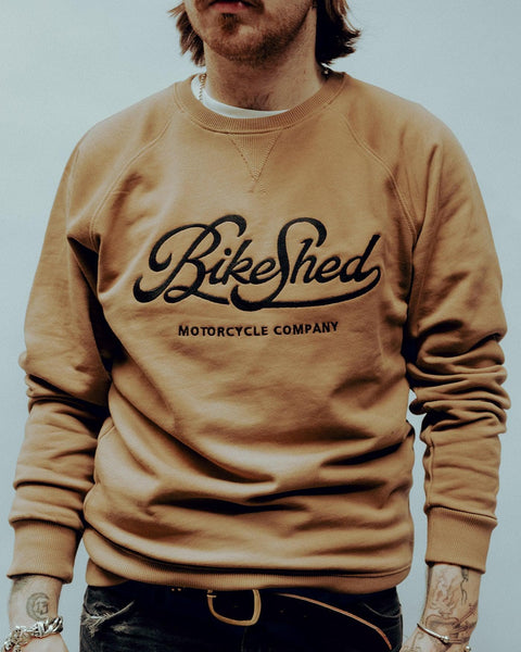 James wearing our BSMC Motorcycle Garage Sweatshirt - Tan/Black