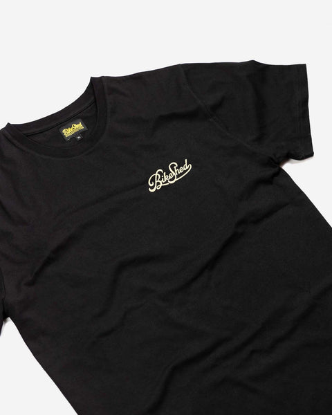 BSMC Motorcycle Garage T Shirt - Black & Gold, side on close up front