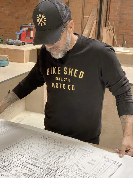 Dutch planning LA opening wearing our Bike Shed Motorcycle Logo Sweatshirt - Black/Gold