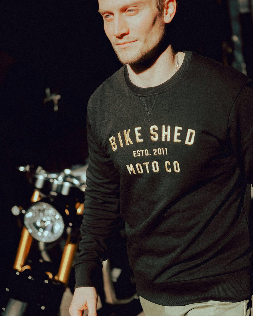 Steve wearing our Bike Shed Motorcycle Logo Sweatshirt  - Black/Gold