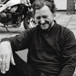 Donny laughing while wearing our BSMC 'Motorcycles Saved My Life' Sweatshirt - WASHED BLACK