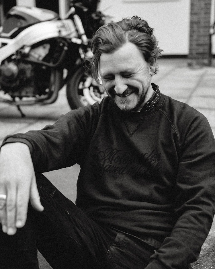 Donny laughing while wearing our BSMC 'Motorcycles Saved My Life' Sweatshirt - WASHED BLACK