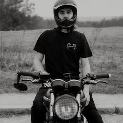 Dan wearing our BSMC Pan T-Shirt sitting on his Triumph