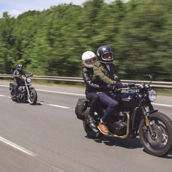 Sam riding his Triumph while wearing our BSMC Protective - Road Jean - Raw Indigo