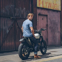 Model sitting on his Honda wearing our BSMC Resistant - BSR01 Jean - Raw Indigo