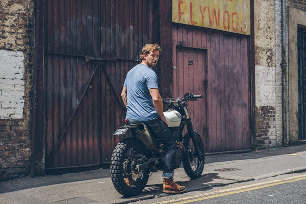 Model sitting on his Honda wearing our Motorcycle Resistant - BSR01 Jeans - Raw Indigo