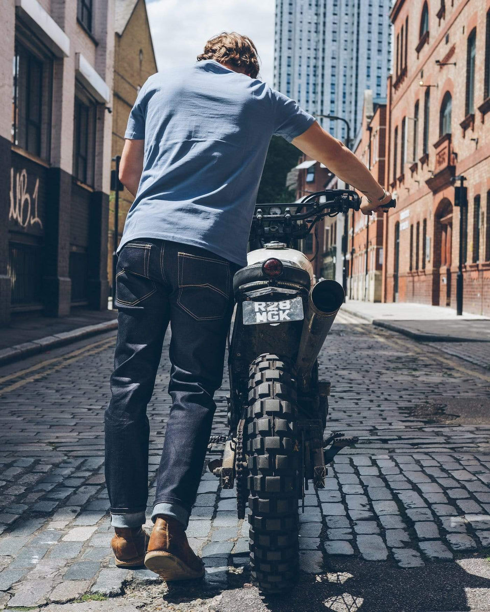 Model pushing his Honda wearing our Motorcycle Resistant - BSR01 Jeans - Raw Indigo