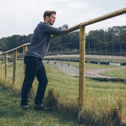 Model by a racetrack wearing our BSMC Resistant - BSR01 Jean - Raw Indigo