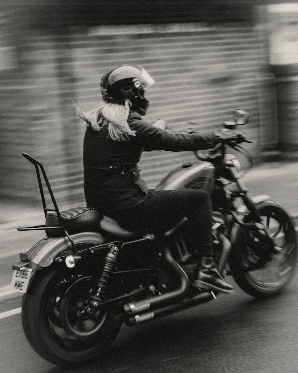 Clare wearing our Motorcycle Resistant Women's Skinny Jean - Black while riding her Harley