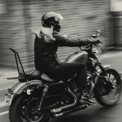 Clare wearing our BSMC Resistant Women's Skinny Jean - Black while riding her Harley