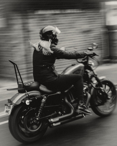 Clare wearing our Motorcycle Resistant Women's Skinny Jean - Black while riding her Harley