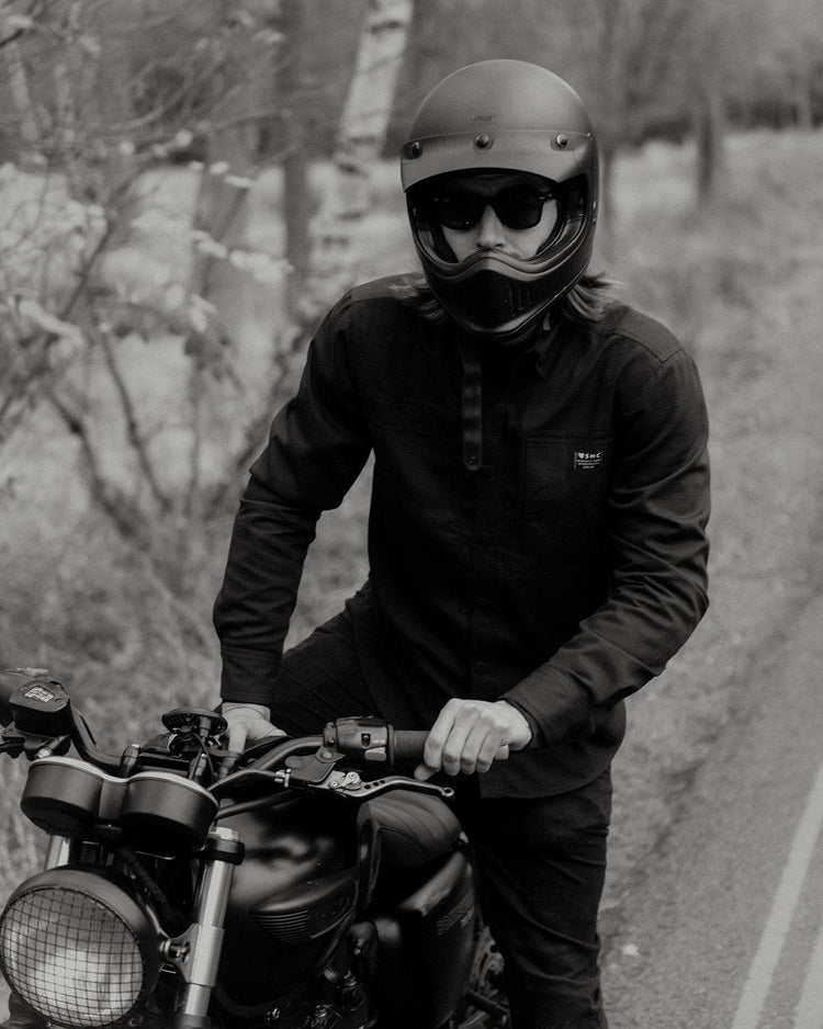 Dan sitting on his Triumph wearing our BSMC Ripstop Utility Shirt MKII - BLACK