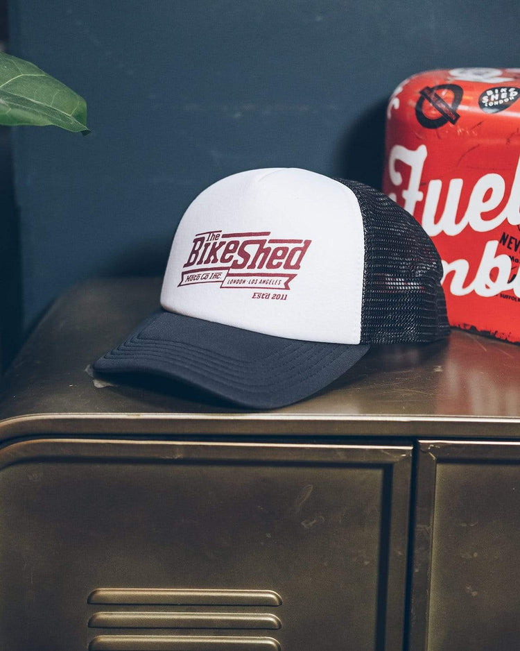 BSMC Steps Trucker Hat, on a cabinet