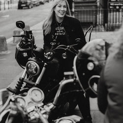 Clare sitting on here Harley wearing our BSMC Ladies Moto Co. T Shirt - Black