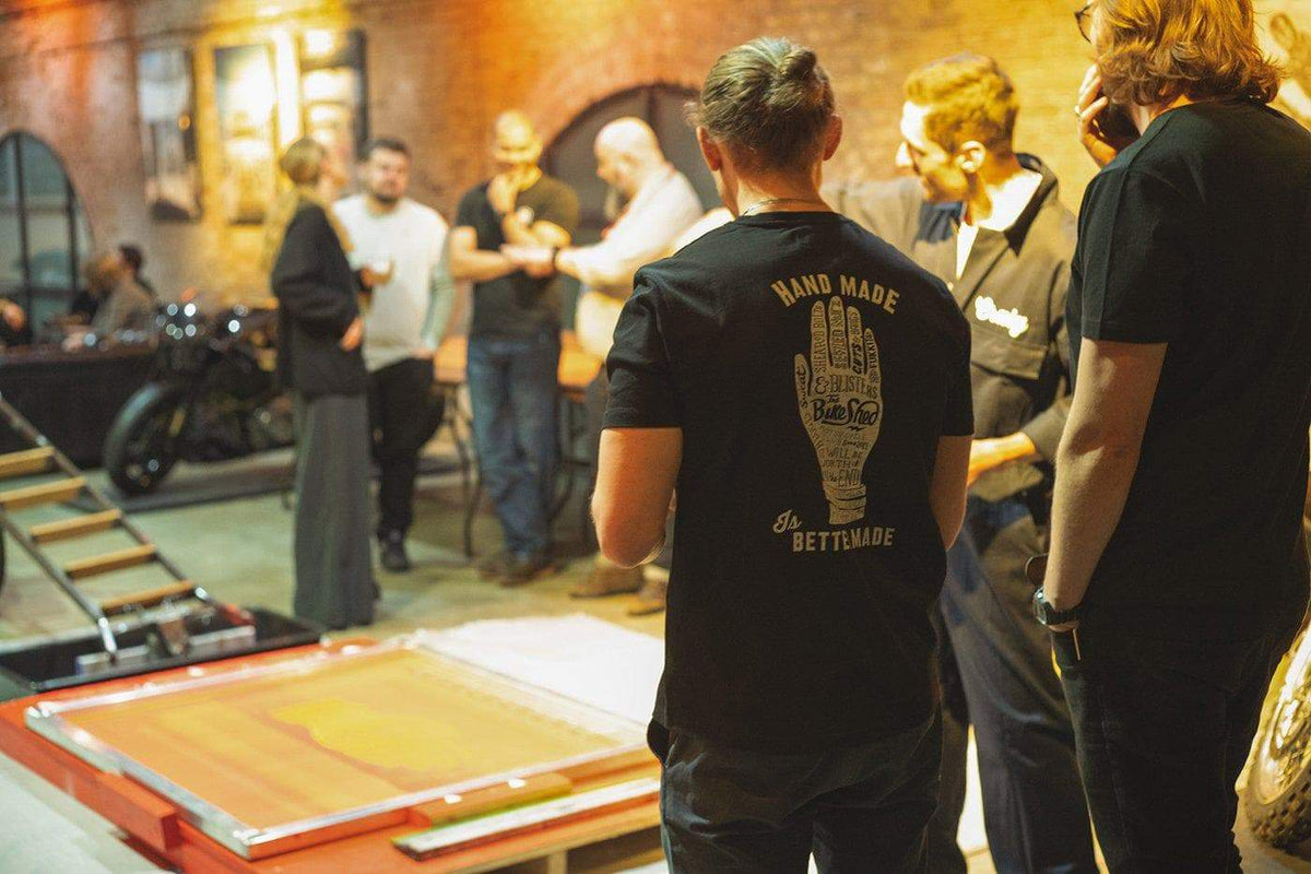 Onlookers watching Dave create his prints